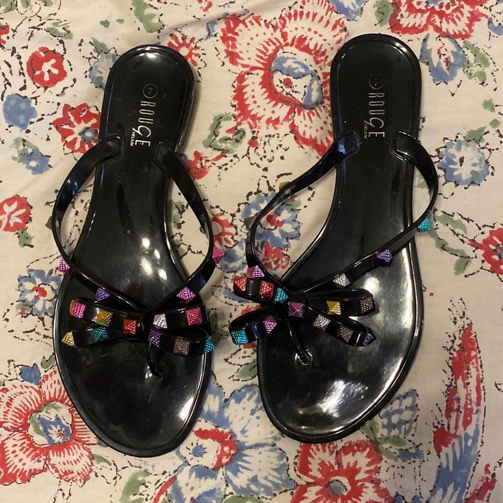Size 7 jelly bow flip flops with multicolored pyramid studs